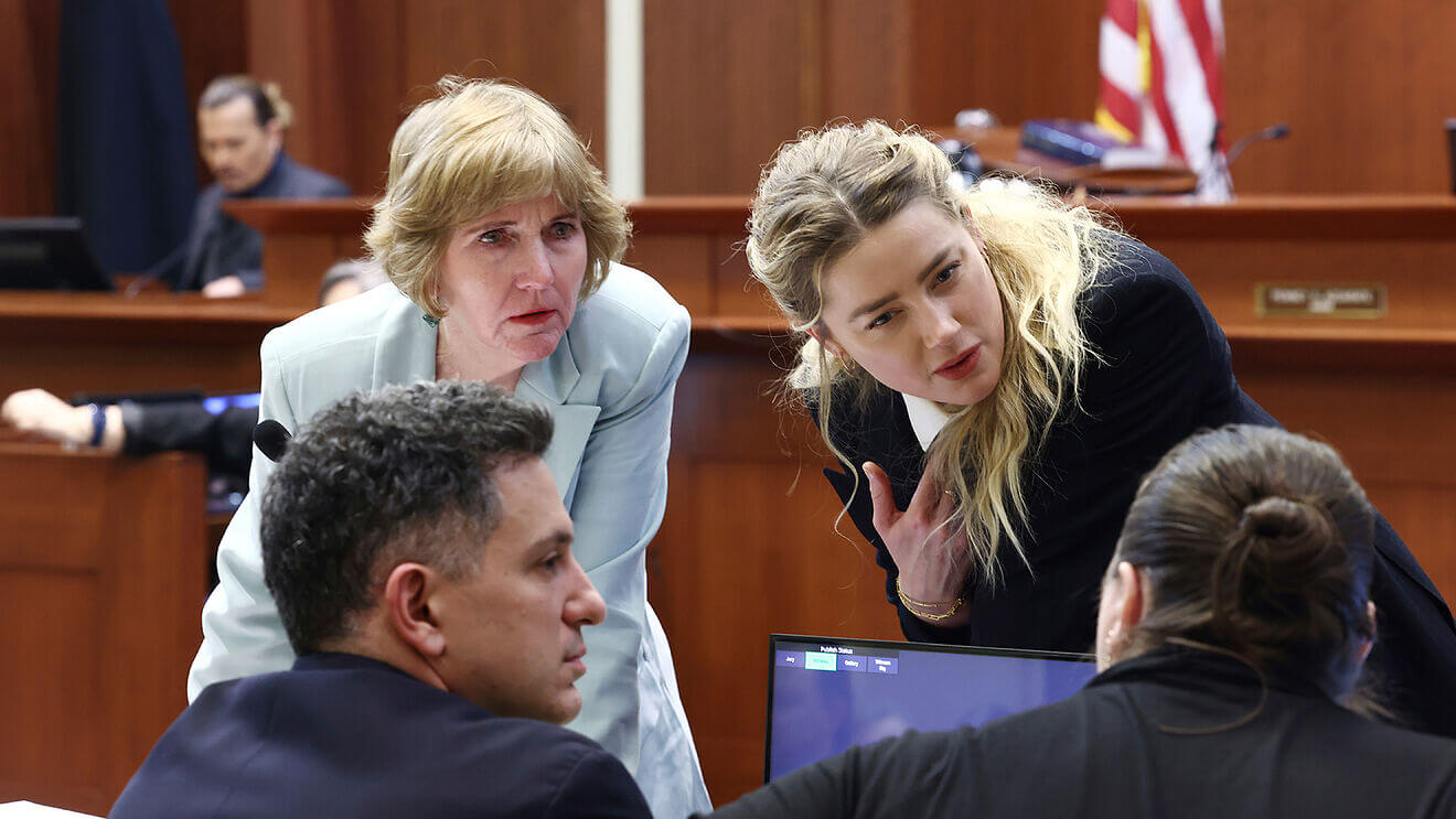 Amber Heard with her lawyers during the trial