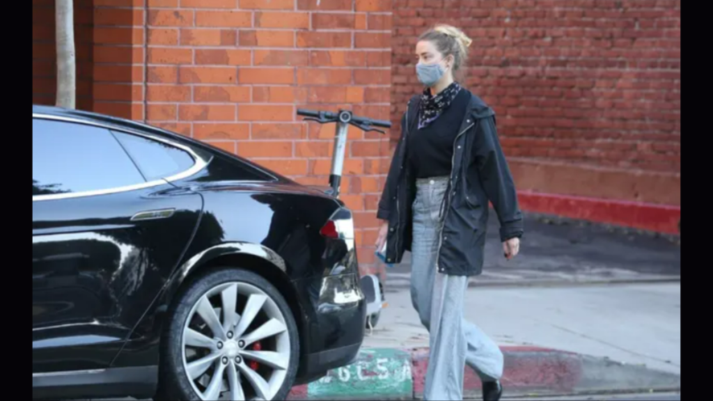 Amber Heard With Tesla