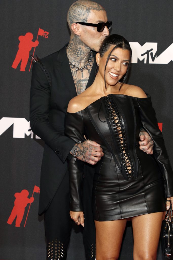 Kourtney Kardashian and Travis Barker at an event