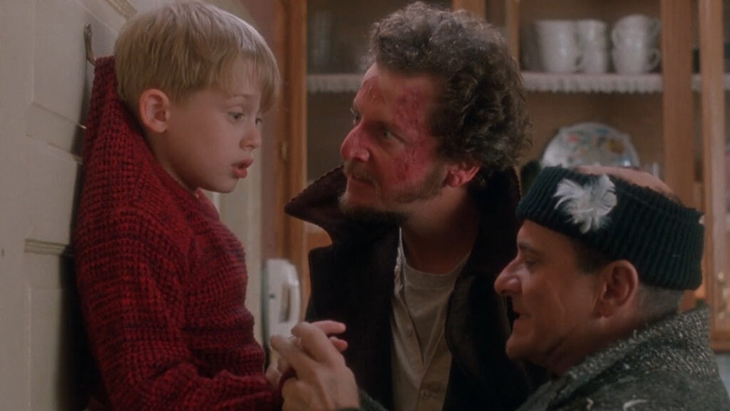 Macaulay Culkin, Joe Pesci and Daniel Stern are pictured as Kevin McCallister and burglars Harry and Marv in a still from Home Alone.